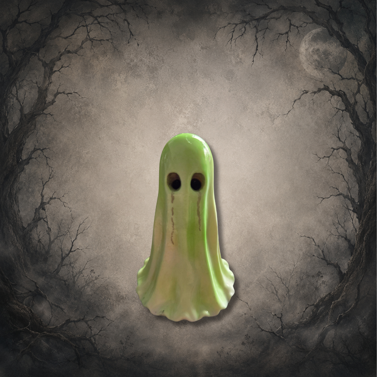 Hand-painted green Afterglow Spirit glow in the dark resin ghost figurine with a pastel finish and spooky expression.
