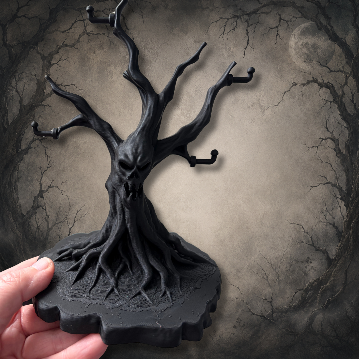 Haunted tree jewellery holder with sculpted roots, twisted branches and gothic styling, designed to organise necklaces and earrings.